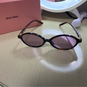 Miu Miu Tortoise Sunglasses with Purple Lenses